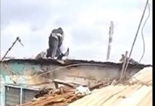 Two men defy odds to fight on a roof